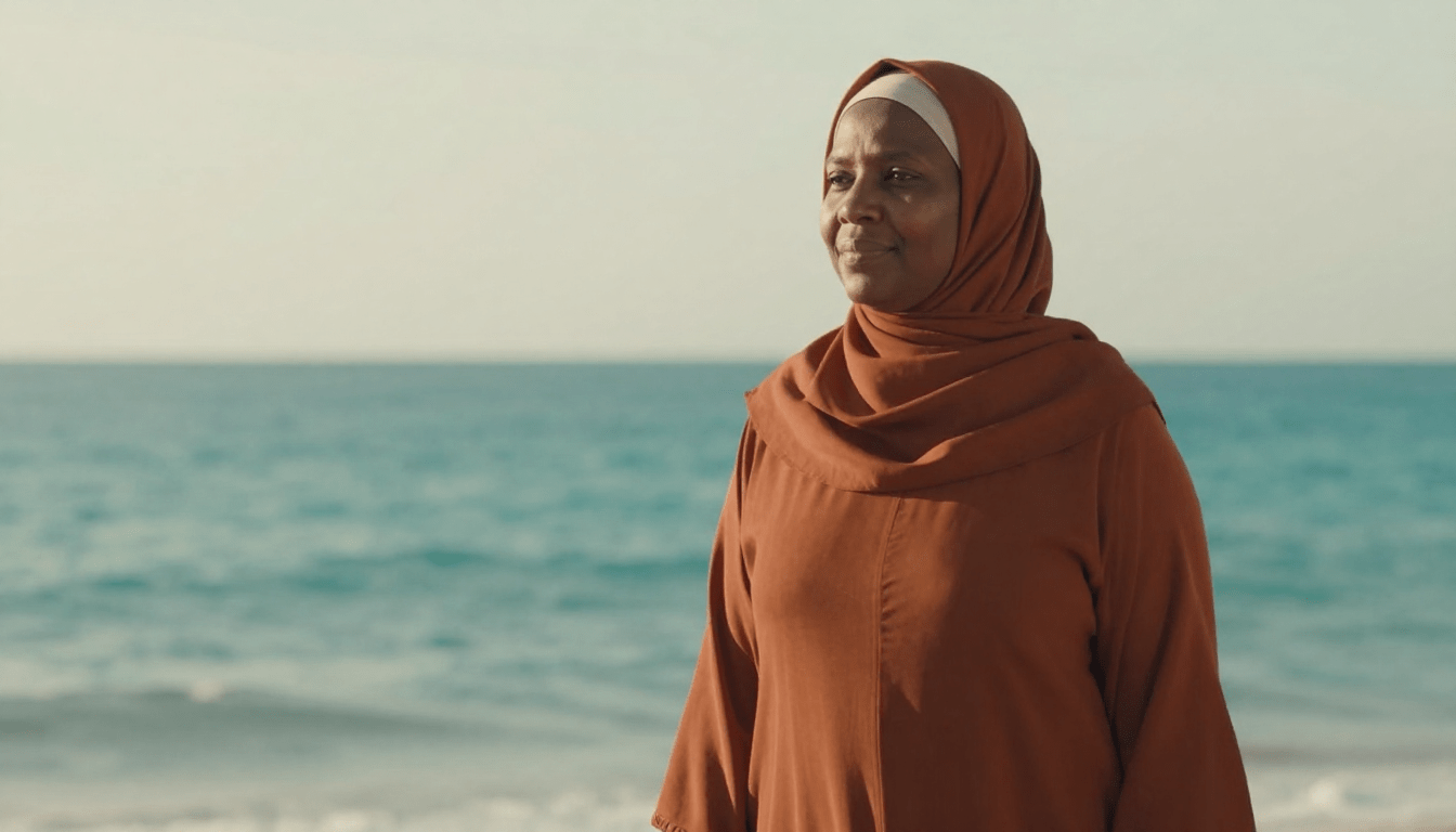 Middle-aged Muslim woman at the beach symbolising Sumayyah’s trauma healing and transformation